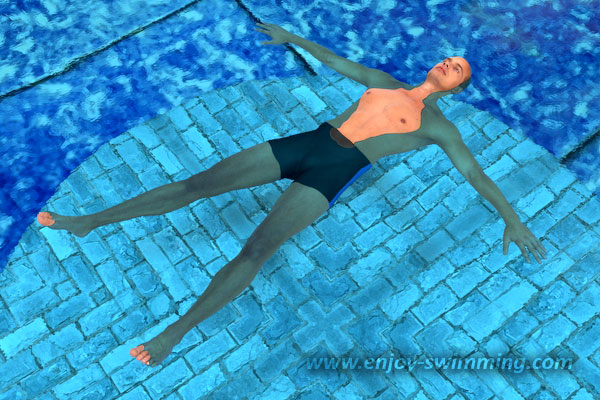 A man in a swimming pool doing the starfish float